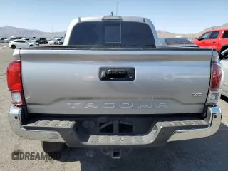 2018 Toyota Tacoma SR5 z VIN 3TMAZ5CN8JM077857, wystawiony jako Copart lot #52570945 z przebiegiem 50 182 mil mil oraz Szkoda całkowita • Salvage title. Historia ofert i sprzedaży dostępna na DreamBid. Obrazek 6.