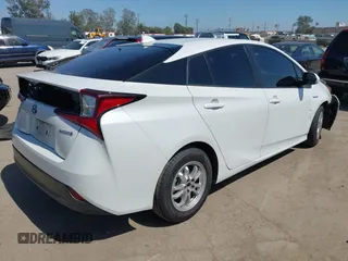 2021 Toyota Prius L Eco with VIN JTDKAMFU8M3135142, listed as a IAAI auction lot 42317007 with 77,353 mi miles and . Bid and sale history available at DreamBid. Image 4.