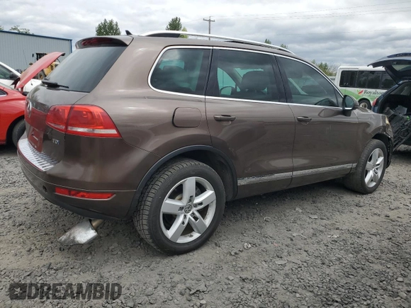 2012 Volkswagen Touareg Lux с VIN WVGEK9BPXCD012003, выставлен на аукционе Copart как лот 54910865 с пробегом 106 465 миль миль и Списание • Salvage title. История ставок и продаж доступна на DreamBid. Изображение 3.