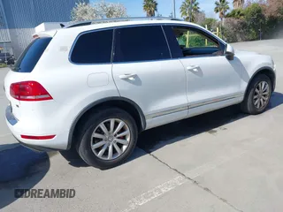 2012 Volkswagen Touareg Sport with VIN WVGEF9BP5CD007294, listed as a IAAI auction lot 41841268 with 160,883 mi miles and . Bid and sale history available at DreamBid. Image 4.