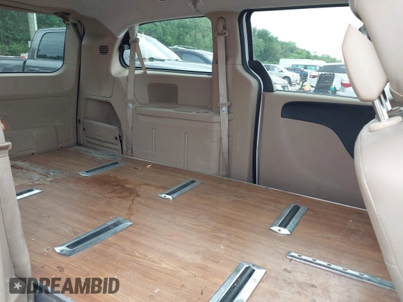 2015 Dodge Grand Caravan SXT with VIN 2C4RDGCG2FR548433, listed as a IAAI auction lot 42121256 with 161,459 mi miles and . Bid and sale history available at DreamBid. Image 8.
