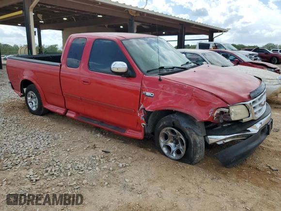 1999 Ford F-150 with VIN 1FTZX1725XNA33332, listed as a Copart auction lot 51867455 with 163,023 mi miles and Salvage title. Bid and sale history available at DreamBid. Image 4.
