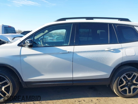 2023 Honda Passport Elite with VIN 5FNYF8H05PB005081, listed as a IAAI auction lot 41698186 with 31,853 mi miles and . Bid and sale history available at DreamBid. Image 14.