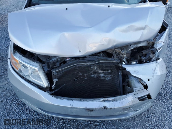 2012 Honda Odyssey Touring with VIN 5FNRL5H9XCB027758, listed as a Copart auction lot 86058504 with 164,860 mi miles and Salvage Title. Bid and sale history available at DreamBid. Image 14.