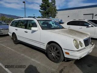 1999 Mercedes-Benz E-Class with VIN WDBJH65F3XA749696, listed as a Copart auction lot 77656084 with 163,802 mi miles and Salvage Title. Bid and sale history available at carsss.com. Image 4.