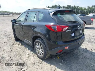 2014 Mazda CX-5 Sport with VIN JM3KE2BE3E0405976, listed as a IAAI auction lot 42161069 with 66,301 mi miles and . Bid and sale history available at carsss.com. Image 3.