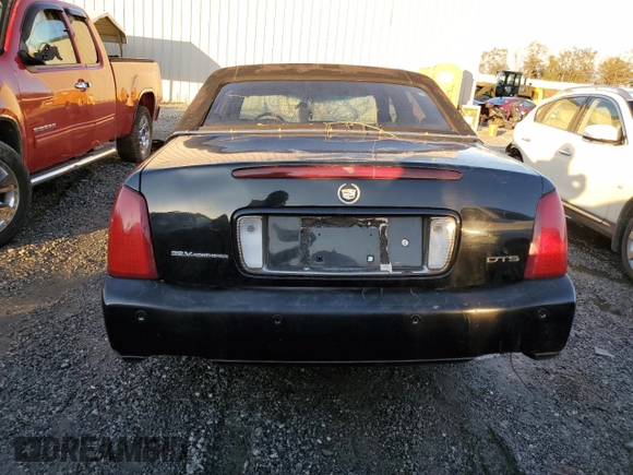 2003 Cadillac DeVille DTS z VIN 1G6KF57963U245281, wystawiony jako Copart lot #79911554 z przebiegiem Nie podano mil oraz Szkody całkowita. Historia ofert i sprzedaży dostępna na DreamBid. Obrazek 6.