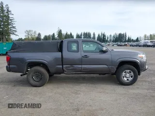 2018 Toyota Tacoma SR z VIN 5TFSX5EN0JX062612, wystawiony jako IAAI lot #41993211 z przebiegiem 92 586 mil mil oraz . Historia ofert i sprzedaży dostępna na DreamBid. Obrazek 13.