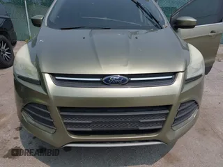 2013 Ford Escape SE z VIN 1FMCU9GX9DUC98437, wystawiony jako IAAI lot #42393299 z przebiegiem 210 014 mil mil oraz . Historia ofert i sprzedaży dostępna na DreamBid. Obrazek 6.