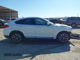 2016 BMW X4 xDrive28i z VIN 5UXXW3C59G0R19977, wystawiony jako IAAI lot #41840665 z przebiegiem 69 353 mil mil oraz . Historia ofert i sprzedaży dostępna na DreamBid. Obrazek 14.