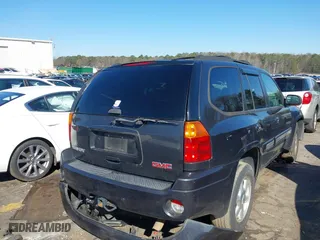 2005 GMC Envoy SLE with VIN 1GKDS13S252305661, listed as a IAAI auction lot 41751800 with 235,090 mi miles. Bid and sale history available at carsss.com. Image 4.