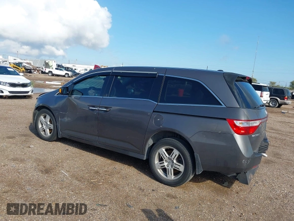 2011 Honda Odyssey Touring with VIN 5FNRL5H93BB104436, listed as a IAAI auction lot 40426003 with 93,342 mi miles and . Bid and sale history available at DreamBid. Image 3.