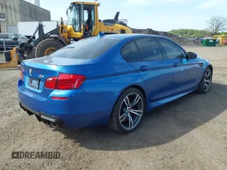 2013 BMW M5 with VIN WBSFV9C56DC774032, listed as a IAAI auction lot 42124754 with 55,409 mi miles. Bid and sale history available at carsss.com. Image 4.