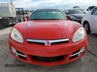 2009 Saturn Sky z VIN 1G8MN35B79Y103875, wystawiony jako Copart lot #74669844 z przebiegiem Nie podano mil oraz Szkody całkowita. Historia ofert i sprzedaży dostępna na DreamBid. Obrazek 5.