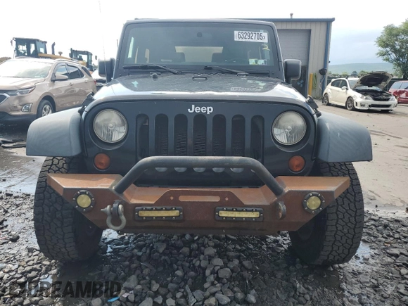 2011 Jeep Wrangler Sport z VIN 1J4GA2D16BL511735, wystawiony jako Copart lot #63292705 z przebiegiem 136 609 mil mil oraz Szkoda całkowita • Salvage title. Historia ofert i sprzedaży dostępna na DreamBid. Obrazek 5.