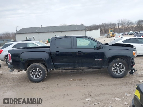 2021 GMC Canyon 4WD AT4 w/Leather with VIN 1GTG6FEN4M1103068, listed as a IAAI auction lot 41673275 with 62,254 mi miles. Bid and sale history available at carsss.com. Image 13.