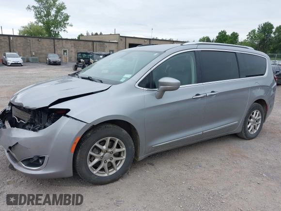 2020 Chrysler Pacifica Touring L with VIN 2C4RC1BG2LR127986, listed as a IAAI auction lot 42419518 with 107,618 mi miles and . Bid and sale history available at DreamBid. Image 2.