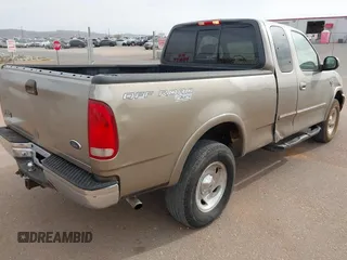2001 Ford F-150 XL with VIN 2FTRX18L61CA36907, listed as a IAAI auction lot 41906933 with 317,857 mi miles. Bid and sale history available at carsss.com. Image 4.