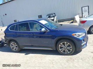 2017 BMW X1 xDrive28i with VIN WBXHT3C33H5F82035, listed as a IAAI auction lot 41944399 with 102,942 mi miles. Bid and sale history available at carsss.com. Image 13.