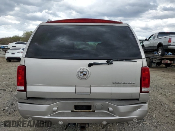2004 Cadillac Escalade z VIN 1GYEK63N04R309148, wystawiony jako Copart lot #51259085 z przebiegiem 106 646 mil mil oraz Czysty tytuł • Clean title. Historia ofert i sprzedaży dostępna na DreamBid. Obrazek 6.