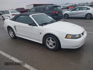 2004 Ford Mustang Deluxe with VIN 1FAFP44604F216659, listed as a IAAI auction lot 41454874 with 72,894 mi miles. Bid and sale history available at carsss.com. Image 1.