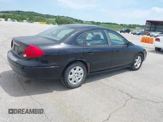 2003 Ford Taurus SE Standard with VIN 1FAFP53U13A102879, listed as a IAAI auction lot 42335795 with 193,023 mi miles and . Bid and sale history available at DreamBid. Image 4.