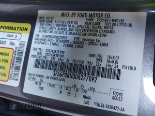 2013 Ford Fusion Titanium Hybrid with VIN 3FA6P0RU0DR277092, listed as a IAAI auction lot 41811079 with 123,071 mi miles. Bid and sale history available at carsss.com. Image 9.