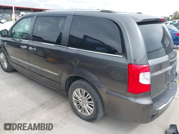 2014 Chrysler Town & Country Touring L with VIN 2C4RC1CG7ER300693, listed as a IAAI auction lot 41849463 with 174,203 mi miles and . Bid and sale history available at carsss.com. Image 3.