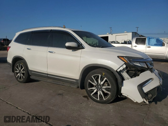 2020 Honda Pilot Touring 8-Passenger with VIN 5FNYF5H97LB009821, listed as a Copart auction lot 70979274 with 70,322 mi miles and Salvage Title. Bid and sale history available at DreamBid. Image 4.
