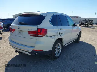2014 BMW X5 sDrive35i with VIN 5UXKR2C53E0C01692, listed as a IAAI auction lot 41727216 with 135,985 mi miles. Bid and sale history available at carsss.com. Image 4.