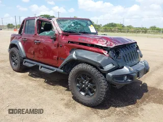 2021 Jeep Wrangler Unlimited Sport S z VIN 1C4HJXDN0MW815350, wystawiony jako IAAI lot #42416714 z przebiegiem 68 869 mil mil oraz . Historia ofert i sprzedaży dostępna na DreamBid. Obrazek 1.