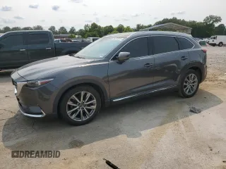 2017 Mazda CX-9 Grand Touring z VIN JM3TCADYXH0138805, wystawiony jako Copart lot #59201915 z przebiegiem 147 896 mil mil oraz Czysty tytuł • Clean title. Historia ofert i sprzedaży dostępna na DreamBid. Obrazek 1.