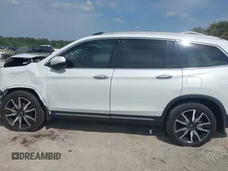 2022 Honda Pilot Touring 7-Passenger z VIN 5FNYF5H67NB027356, wystawiony jako IAAI lot #42080323 z przebiegiem 56 826 mil mil oraz . Historia ofert i sprzedaży dostępna na DreamBid. Obrazek 14.