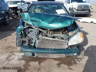2002 Honda Civic LX with VIN 1HGEM22522L018081, listed as a IAAI auction lot 41329541 with 87,534 mi miles. Bid and sale history available at carsss.com. Image 6.