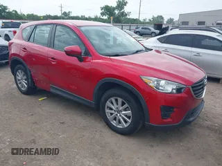 2016 Mazda CX-5 Sport z VIN JM3KE2BY8G0853403, wystawiony jako IAAI lot #42364332 z przebiegiem 93 294 mil mil oraz . Historia ofert i sprzedaży dostępna na DreamBid. Obrazek 1.