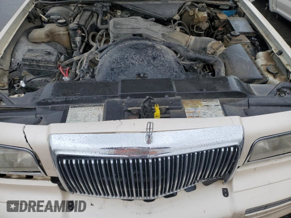 1995 Lincoln Town Car Cartier z VIN 1LNLM83W2SY603452, wystawiony jako Copart lot #55756595 z przebiegiem 243 394 mil mil oraz Szkoda całkowita • Salvage title. Historia ofert i sprzedaży dostępna na DreamBid. Obrazek 11.