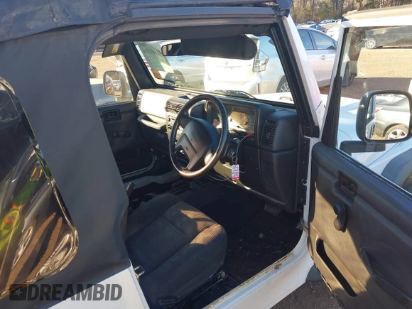 2004 Jeep Wrangler Sport Right Hand Drive with VIN 1J4F449S74P732854, listed as a IAAI auction lot 41408316 with 112,064 mi miles. Bid and sale history available at carsss.com. Image 5.