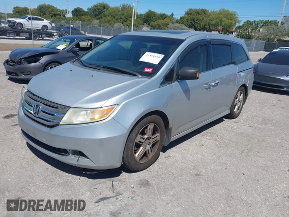 2012 Honda Odyssey Touring with VIN 5FNRL5H90CB099519, listed as a IAAI auction lot 41854550 with 185,110 mi miles. Bid and sale history available at carsss.com. Image 18.