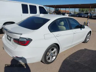 2014 BMW 3 Series 328i xDrive with VIN WBA3B3C56EJ981496, listed as a IAAI auction lot 41822862 with 137,700 mi miles. Bid and sale history available at carsss.com. Image 4.