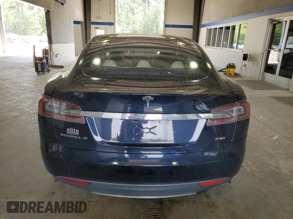 2014 Tesla Model S 60 with VIN 5YJSA1H10EFP52850, listed as a Copart auction lot 54321805 with 58,031 mi miles and Salvage Title. Bid and sale history available at DreamBid. Image 6.