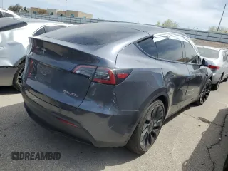 2022 Tesla Model Y Performance with VIN 7SAYGDEF1NF491967, listed as a Copart auction lot 51119515 with 50,520 mi miles and Salvage title. Bid and sale history available at DreamBid. Image 3.