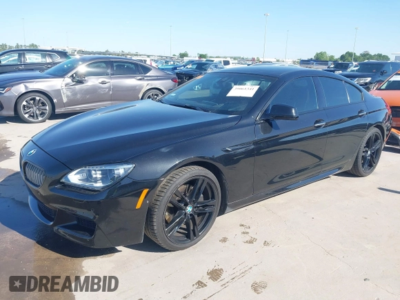 2014 BMW 6 Series 650i z VIN WBA6B2C55ED129419, wystawiony jako IAAI lot #39061341 z przebiegiem 68 790 mil mil oraz . Historia ofert i sprzedaży dostępna na DreamBid. Obrazek 2.