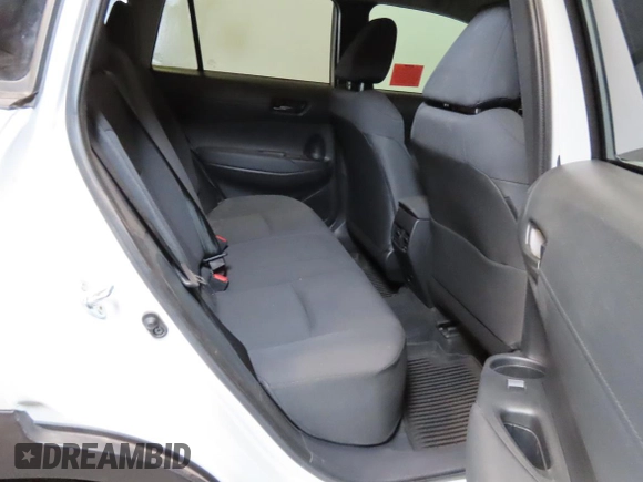2023 Toyota Corolla Cross LE with VIN 7MUCAAAG2PV052111, listed as a Copart auction lot 64481675 with 18,125 mi miles and Salvage title. Bid and sale history available at DreamBid. Image 6.