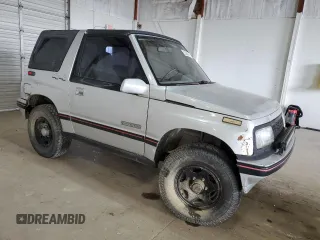 1990 Geo Tracker z VIN 2CNBJ18UXL6218795, wystawiony jako Copart lot #53083615 z przebiegiem 83 413 mil mil oraz Szkody całkowita. Historia ofert i sprzedaży dostępna na DreamBid. Obrazek 4.