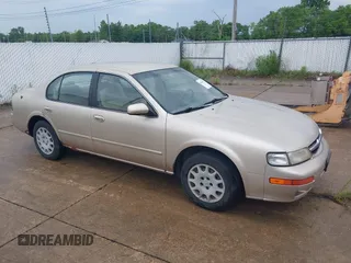 1997 Nissan Maxima GXE z VIN JN1CA21D1VT201969, wystawiony jako IAAI lot #42414733 z przebiegiem 237 413 mil mil oraz . Historia ofert i sprzedaży dostępna na DreamBid. Obrazek 1.