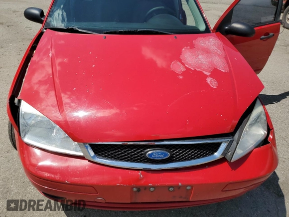 2007 Ford Focus S z VIN 1FAFP34NX7W360015, wystawiony jako Copart lot #57499655 z przebiegiem 237 516 mil mil oraz Szkoda całkowita • Salvage title. Historia ofert i sprzedaży dostępna na DreamBid. Obrazek 11.