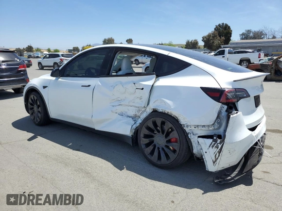 2022 Tesla Model Y Performance z VIN 7SAYGDEF6NF397082, wystawiony jako Copart lot #55823435 z przebiegiem Nie podano mil oraz Szkoda całkowita • Salvage title. Historia ofert i sprzedaży dostępna na DreamBid. Obrazek 2.