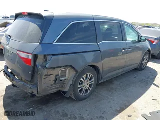 2012 Honda Odyssey EX-L with VIN 5FNRL5H64CB131197, listed as a IAAI auction lot 41829107 with 215,115 mi miles. Bid and sale history available at carsss.com. Image 4.