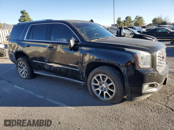 2018 GMC Yukon Denali with VIN 1GKS1CKJ0JR106589, listed as a Copart auction lot 79977034 with 98,022 mi miles and Salvage Title. Bid and sale history available at carsss.com. Image 4.