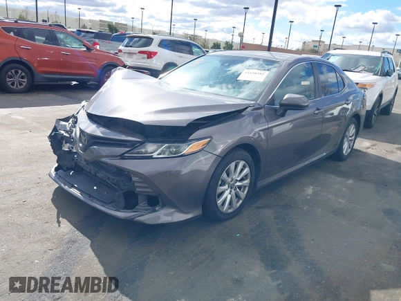 2020 Toyota Camry LE with VIN 4T1C11AK3LU363417, listed as a IAAI auction lot 41430382 with 130,837 mi miles. Bid and sale history available at carsss.com. Image 2.